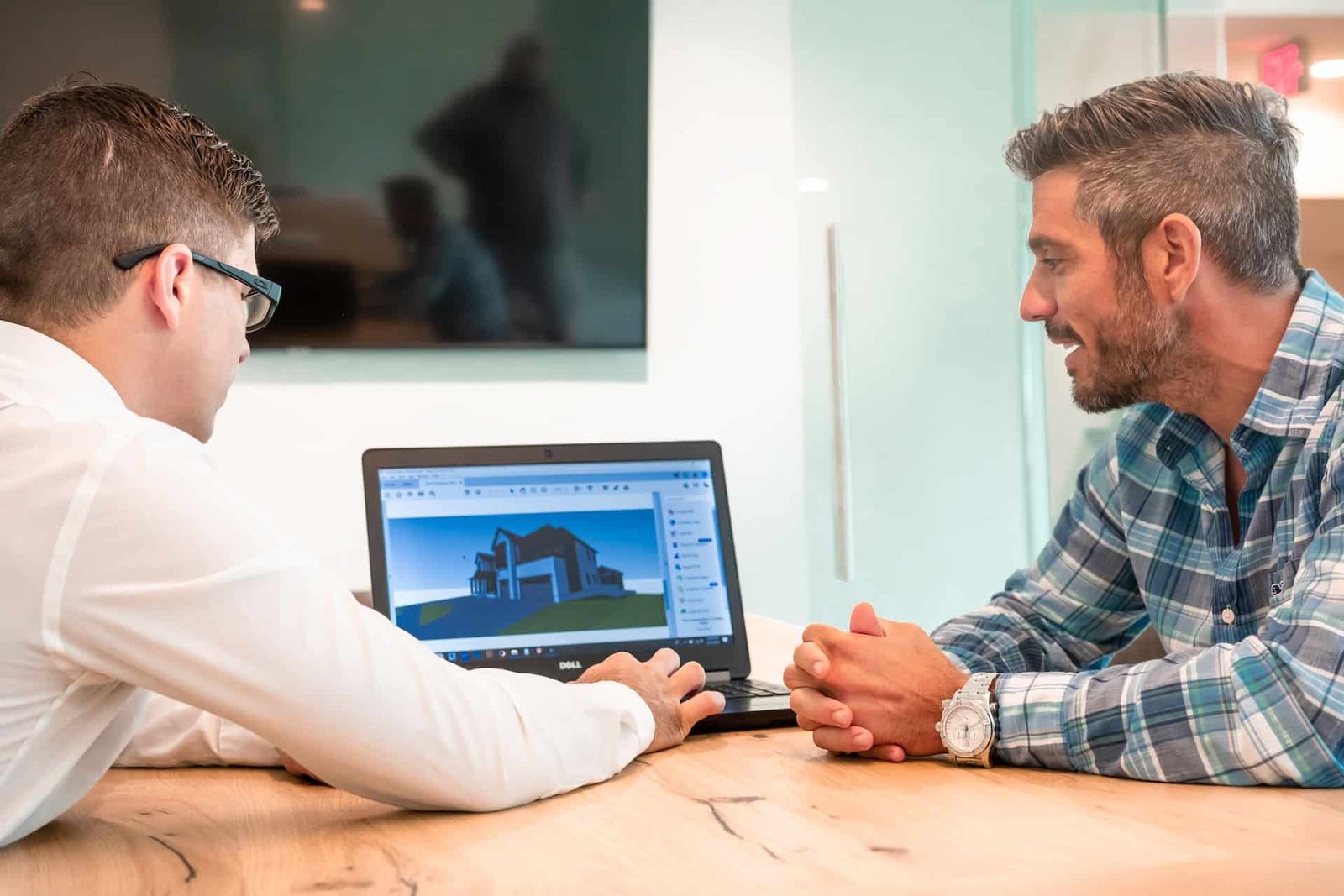 Two men admiring the customization of their new business website