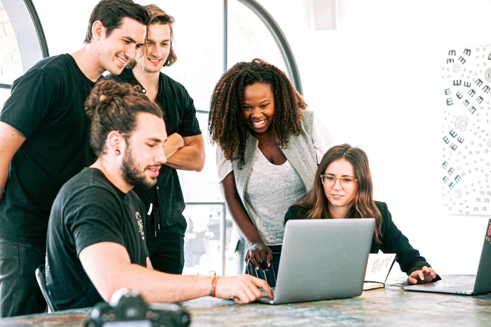 A group of people admiring a new, professional business website