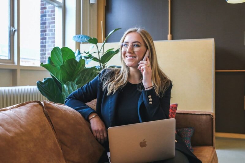 A woman talking to her web design company on the phone